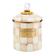 MacKenzie-Childs Mocha Check Small Canister with hand-painted checkerboard pattern, gold-rimmed lid, clear glass knob, and gold-toned nameplate, ideal for versatile kitchen storage.