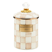 MacKenzie Childs | Mocha Check Medium Canister features hand-painted cream and beige checks, a brass nameplate, and a domed lid with an ornate gold-tone fitting.