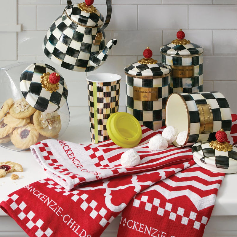 MacKenzie-Childs Courtly Check Large Canister displayed with matching ceramics and linens on a kitchen countertop, highlighting its elegant, hand-painted design and versatile use.