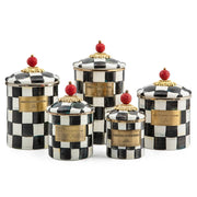 MacKenzie Childs | Courtly Check Large Canister set with hand-painted checkerboard design, gold-tone labels, sculpted red finials, perfect for versatile kitchen storage.