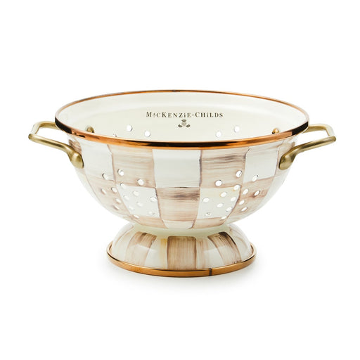 MacKenzie-Childs | Mocha Check Small Colander: Oval, enameled colander with hand-painted checkerboard pattern, warm metallic rim, raised base, and antiqued brass-finished handles, ideal for kitchen tasks.