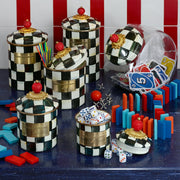 MacKenzie Childs | Cookie Jar with Courtly Check Lid, surrounded by game pieces and straws, showcasing its versatile style for any kitchen setting.