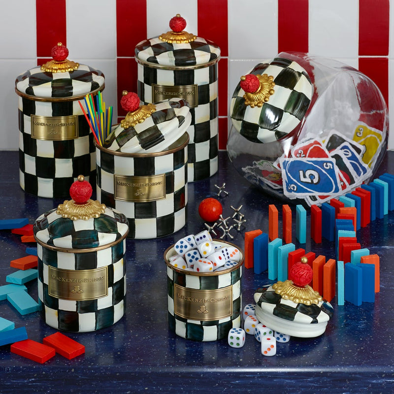 MacKenzie Childs | Cookie Jar with Courtly Check Lid, surrounded by game pieces and straws, showcasing its versatile style for any kitchen setting.