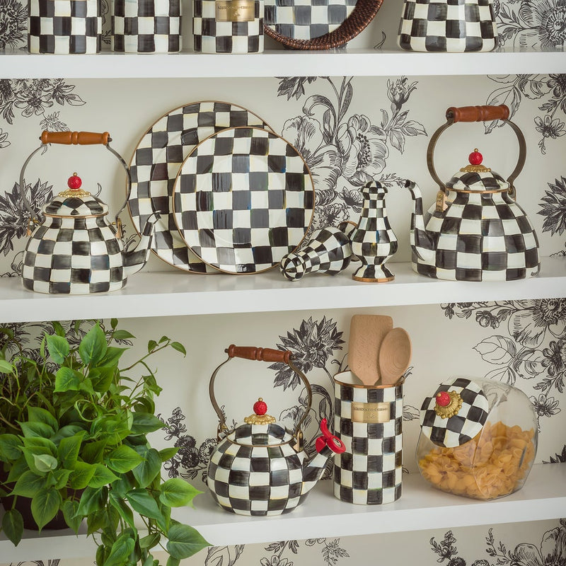 MacKenzie Childs | Cookie Jar with Courtly Check Lid displayed on open shelves, featuring black-and-white checkerboard ceramics, enhancing kitchen decor with style and function.