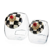 MacKenzie Childs | Cookie Jar with Courtly Check Lid: Two elegant glass jars featuring distinctive checkerboard lids, ideal for storing treats or enhancing kitchen decor.