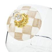 MacKenzie Childs | Cookie Jar with Mocha Check Lid features a hand-painted checkerboard lid with a gold rosette and crystal knob, highlighting its elegant design.