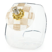 MacKenzie Childs | Cookie Jar with Mocha Check Lid: Clear glass jar with ornate gold rosette and crystal-like knob, showcasing elegant hand-painted mocha check lid.
