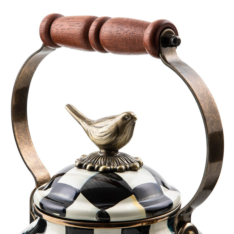 MacKenzie Childs | Courtly Check with Bird Tea Kettle, 3 QT lid features a black-and-white harlequin design, topped with a brass bird finial and wooden grip handle.