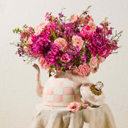 MacKenzie-Childs | Rosy Check Tea Kettle, 3 QT, repurposed as a vase with pink blooms, showcasing its hand-painted checkerboard pattern and elegant design.