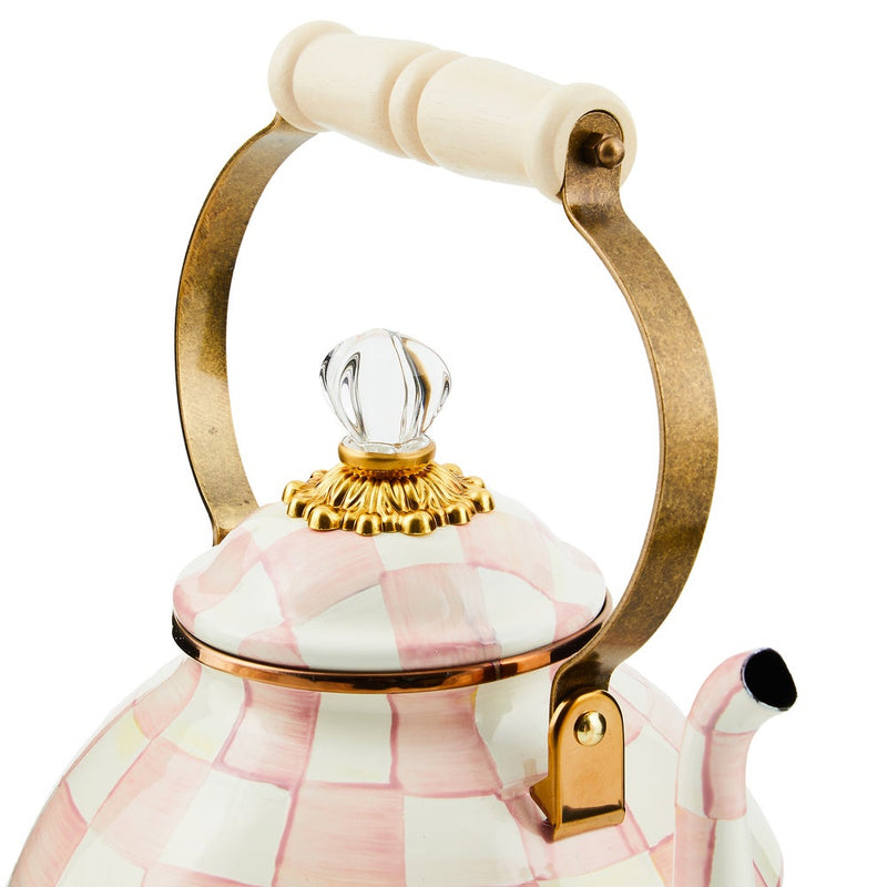 MacKenzie Childs | Rosy Check Tea Kettle, 3 QT: Decorative ceramic teapot with pink-white checks, brass-finished handle, wood grip, and glass knob, showcasing artisan elegance.