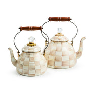 MacKenzie Childs | Mocha Check Tea Kettle, 3 QT: Two ceramic kettles with hand-painted checks, clear glass knobs, and black metal handles with wooden grips.