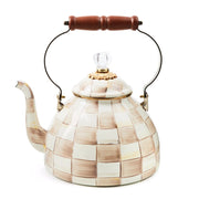 MacKenzie Childs | Mocha Check Tea Kettle, 3 QT, with a cream-and-beige checkerboard pattern, curved spout, wooden handle, glass knob, and gold trim.
