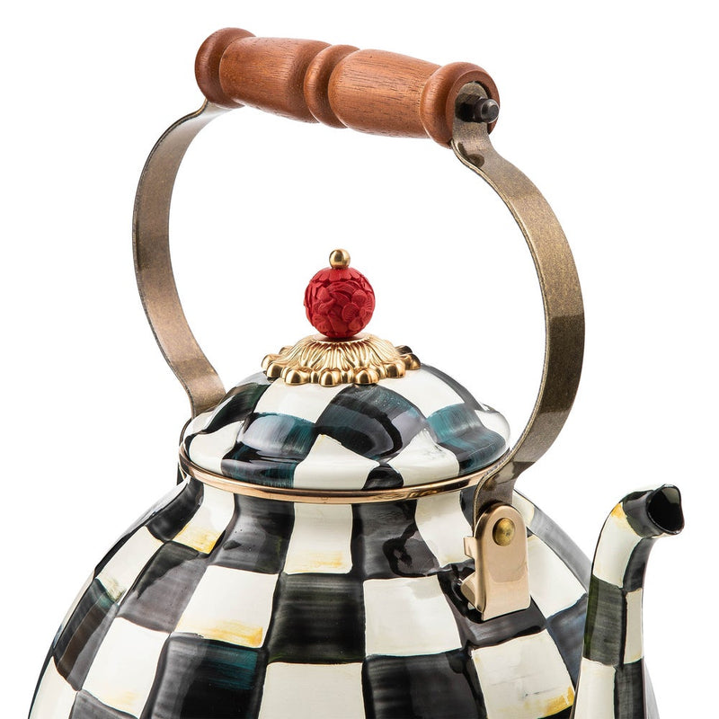MacKenzie Childs Courtly Check Tea Kettle, 3 QT., featuring a black-and-white checkerboard design, wooden handle, and red finial atop a gold-tone base.