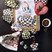 MacKenzie-Childs Courtly Check Ice Cream Dish in a tea-time setting with matching checkerboard teapot and accessories, showcasing elegant dining ware from Athens Cooks.