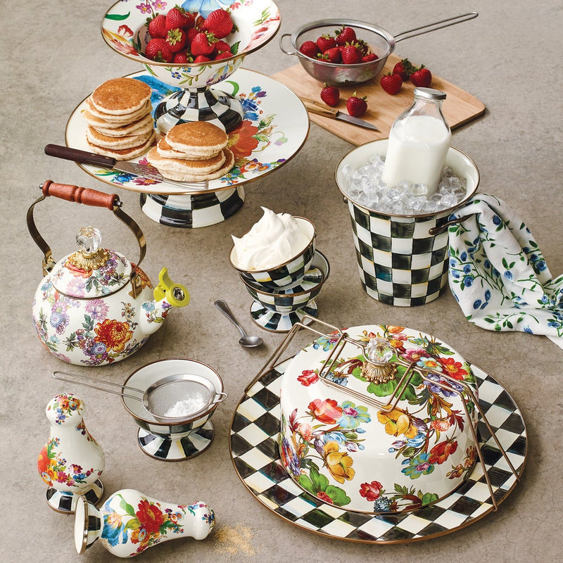 MacKenzie-Childs Courtly Check Ice Cream Dish holds whipped cream in a stylized brunch spread with floral-and-checkered ceramics, enhancing the elegant tabletop presentation.