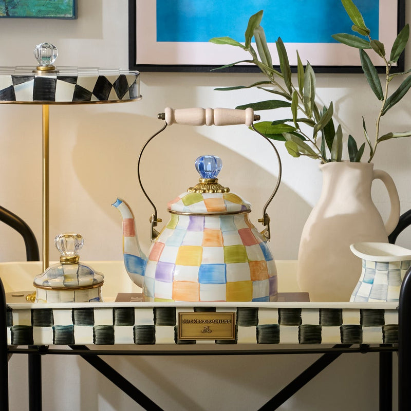 MacKenzie-Childs Confetti Check Tea Kettle, 2 QT, on a serving tray with matching ceramic pieces, epitomizing Athens Cooks' curated kitchen elegance.