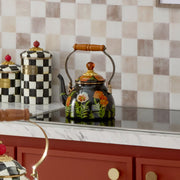 Mackenzie Childs | Poppy Tea Kettle, 2 QT, with floral design and wooden handle, centered on a stovetop with matching ceramic canisters in a kitchen setting.