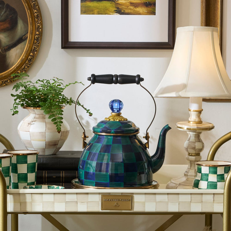 Mackenzie Childs | Juniper Check Tea Kettle, 2 QT., displayed with matching cups and a fern vase on a decorative tea cart.