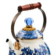 MacKenzie-Childs Royal English Garden 2 Quart Tea Kettle with blue floral pattern, brass-tone spout, acacia wood handle, and blue glass finial, ideal for Athens Cooks.