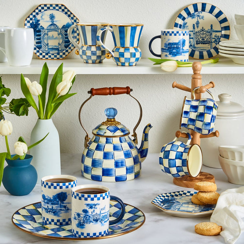 MacKenzie Childs | Royal Check Tea Kettle, 2 QT., on a marble table with matching blue-and-white mugs, plates, and tulips, creating an elegant tea service display.