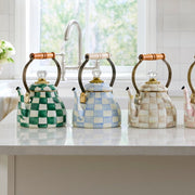 MacKenzie-Childs | Sky Check Tea Kettle, 2 Qt, with pastel checks, wooden grip, and glass finial, on a bright kitchen countertop at Athens Cooks.