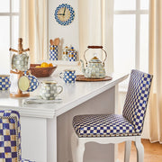 MacKenzie Childs | Sterling Check Tea Kettle, 2 QT. on a sunlit kitchen table with matching mugs, wooden bowl of lemons, and blue-and-white check decor.