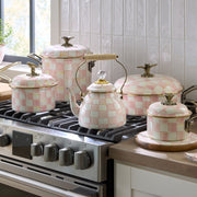 MacKenzie Childs | Rosy Check Tea Kettle, 2 QT on a stovetop, surrounded by matching cookware, showcasing pink-and-white checks and brass accents, embodies Athens Cooks' curated style.