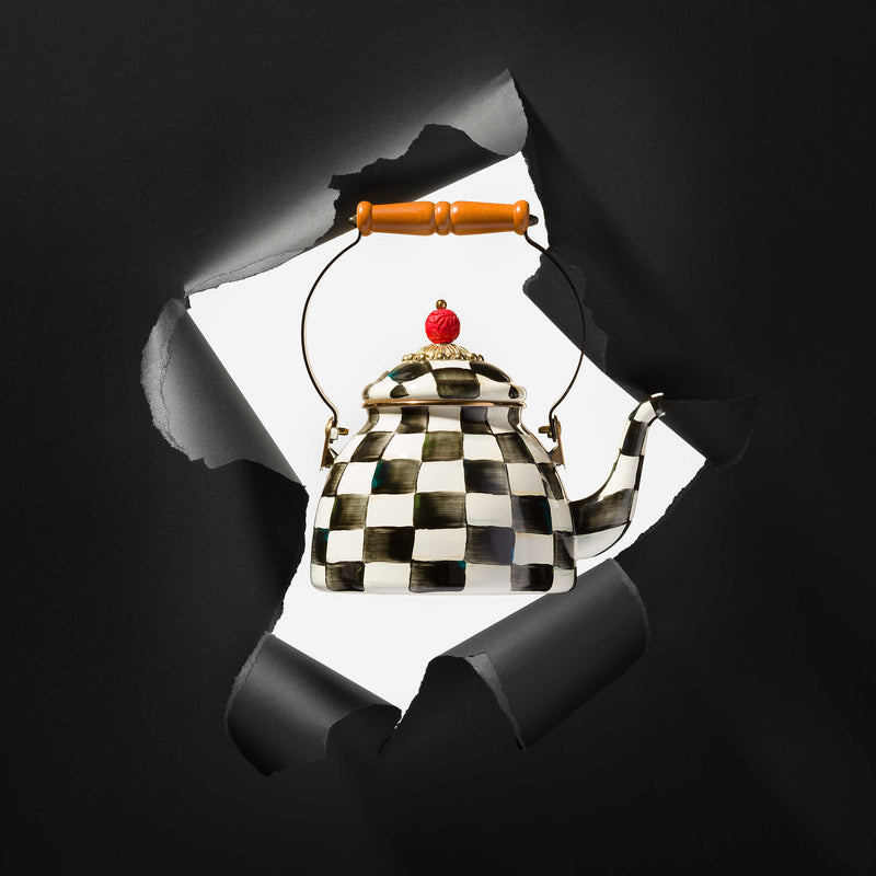 MacKenzie Childs | Courtly Check 2 Quart Tea Kettle with black and white checks, wooden handle, and red top bead, showcasing a stylish design ideal for kitchen display.