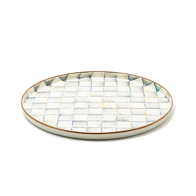 MacKenzie-Childs Sterling Check Round Tray: A hand-painted, gray-checked, oval serving tray with a gold-accented rim, perfect for stylishly serving drinks or displaying decor.