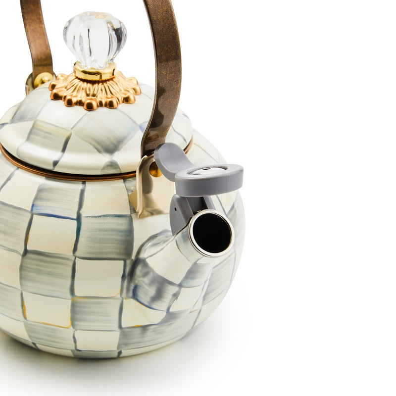 MacKenzie Childs | Sterling Check Whistling Tea Kettle with hand-painted grey checks, metal handle, and flip-up spout cover, featuring a clear glass knob.