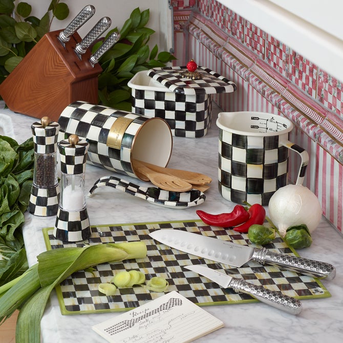 MacKenzie-Childs Courtly Check Recipe Box on checkered kitchenware display, surrounded by fresh produce, knives, and utensils, perfectly blending functionality and elegance in a curated kitchen setting.