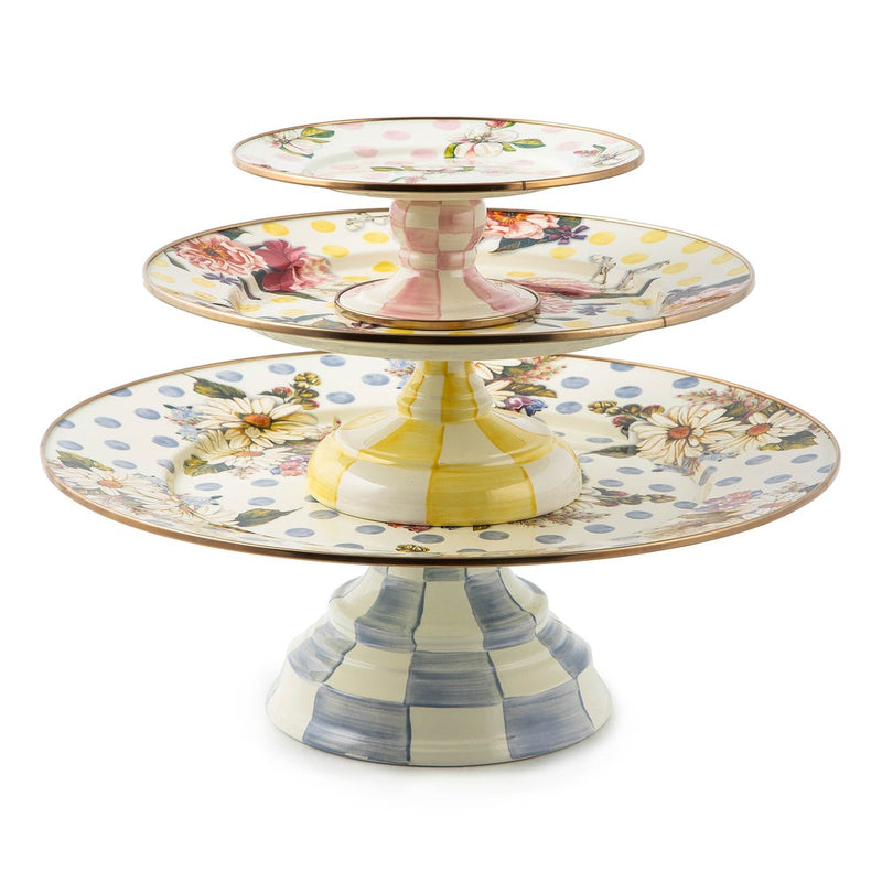 MacKenzie Childs | Wildflowers Blue Large Pedestal Platter: A decorative three-tiered ceramic stand with hand-painted floral motifs and pastel striped pedestals, perfect for elegant gatherings.