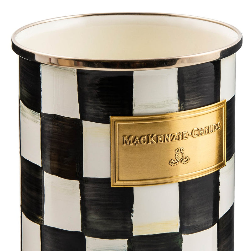 MacKenzie Childs | Courtly Check Utensil Holder: Cylindrical ceramic holder with hand-painted black-and-white checkerboard pattern, gold-tone rim, and plaque, ideal for kitchen tools.