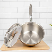 Heritage Steel 2 quart titanium saucier with lid, featuring a polished stainless steel finish and ergonomic handle