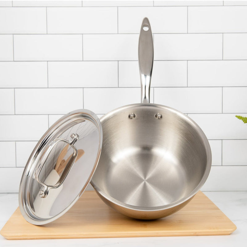 Heritage Steel 2 quart titanium saucier with lid, featuring a polished stainless steel finish and ergonomic handle