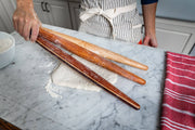 Earlywood | French Rolling Pin - Jatoba showcased in a kitchen setting, emphasizing its sleek, tapered design for enhanced control and maneuverability during baking.