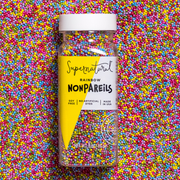 Supernatural - Dye-Free Rainbow Nonpareils Sprinkles, 3oz: A clear jar with multicolored sprinkles, emphasizing natural ingredients and allergen-free, perfect for creative baking at Athens Cooks.