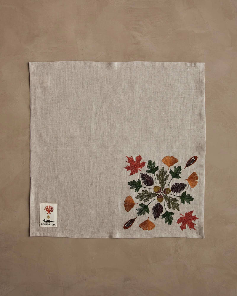 Coral & Tusk - Pressed Leaves Dinner Napkin, featuring embroidered autumn leaves and acorns, perfect for seasonal dining. Measures 20 × 20, ideal for fall table settings.