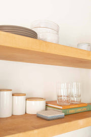 Graf Lantz - Bierfilzl Merino Wool Felt Square Coaster Multi 4 Pack: Cobblestone displayed on a shelf with kitchenware, emphasizing modern, refined home decor.