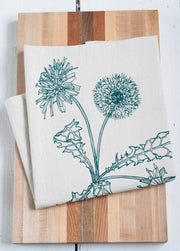 Hearth and Harrow - Organic Cotton Dandelion Tea Towel, featuring a green dandelion design, hand-printed in Rockport, Maine, on a large flour sack towel.