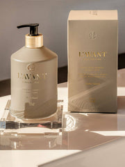 L'AVANT Collective - Hand Soap Ambre Santal in a matte taupe bottle with black pump, accompanied by a matching branded box, reflecting luxury and eco-conscious design.
