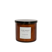 Slow North - Lavender + Cedar Signature 3-Wick Candle in amber glass jar with black lid, features relaxing, earthy scent, hand-poured, 17 oz soy candle from Athens Cooks.