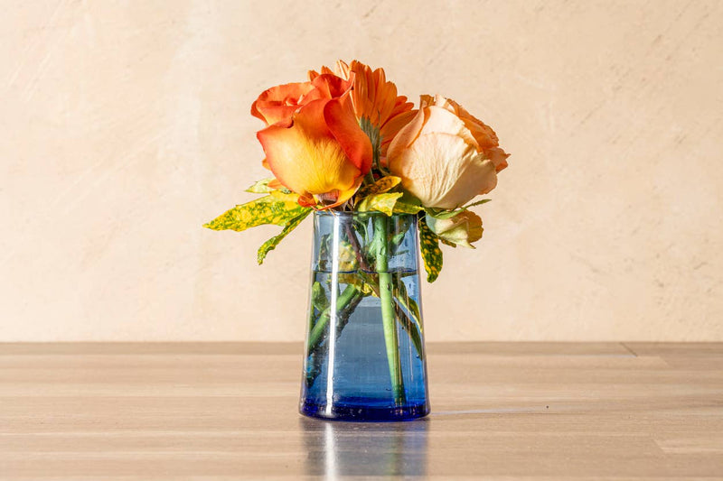Set of six Moroccan Cone Glassware Large - Blue, hand-blown with visible bubbles, crafted from recycled bottles, ideal for beverages or decorative use.