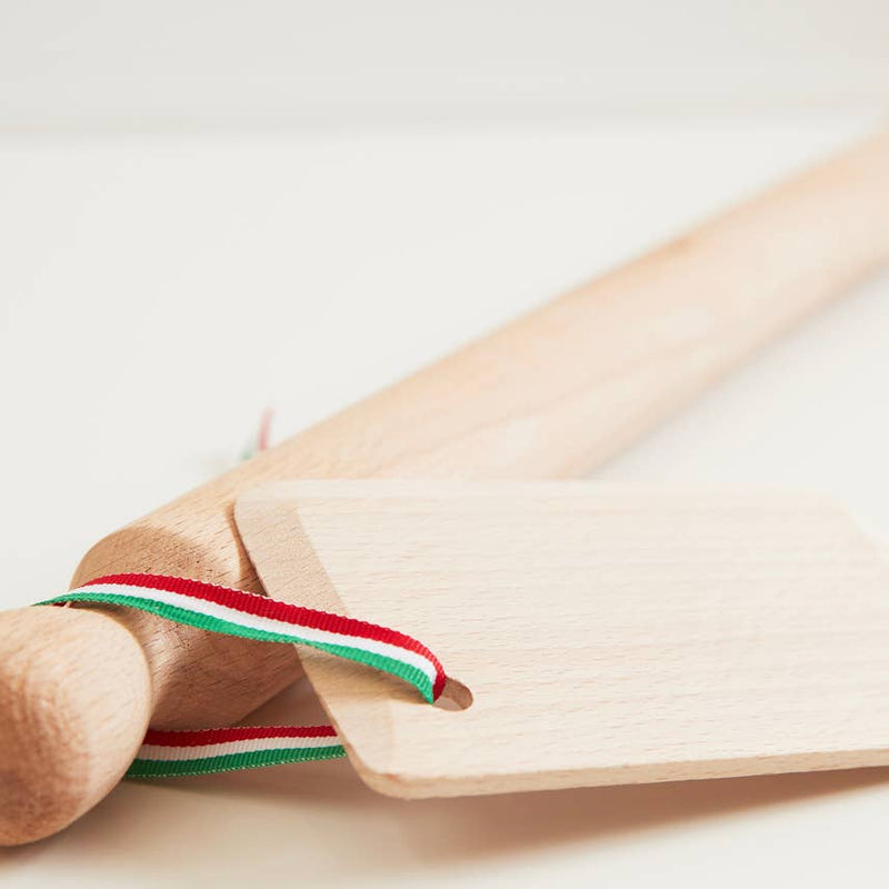 Italian Beechwood Rolling Pin and Dough Scraper Set, featuring a wooden rolling pin with tag and ribbon, ideal for rolling pasta dough.