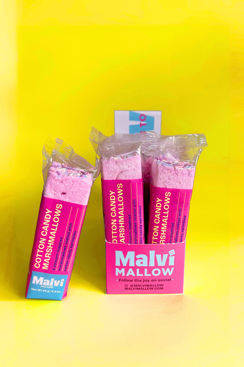 Malvi Mallow - Cotton Candy 4-Pack Marshmallows, Case of 12 Packs displayed with pink packaging, showcasing unicorn-inspired marshmallow bars coated in sprinkles.
