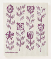 Three Bluebirds Swedish Dishcloths - Plum Garden design featuring purple floral patterns on a white napkin, ideal for kitchen use and environmentally friendly cleaning.