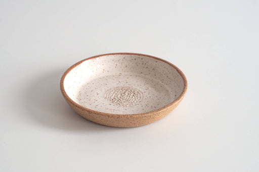 RachaelPots - Garlic Scraper: Nude/White, a handmade ceramic dish with off-white speckled glaze, ideal for creating garlic puree effortlessly.
