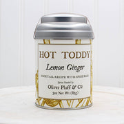 Oliver Pluff & Company - Lemon Ginger Hot Toddy Kit: Small tin with spices for making lemon-ginger hot toddy cocktails, including cinnamon sticks, lemongrass, and ginger.