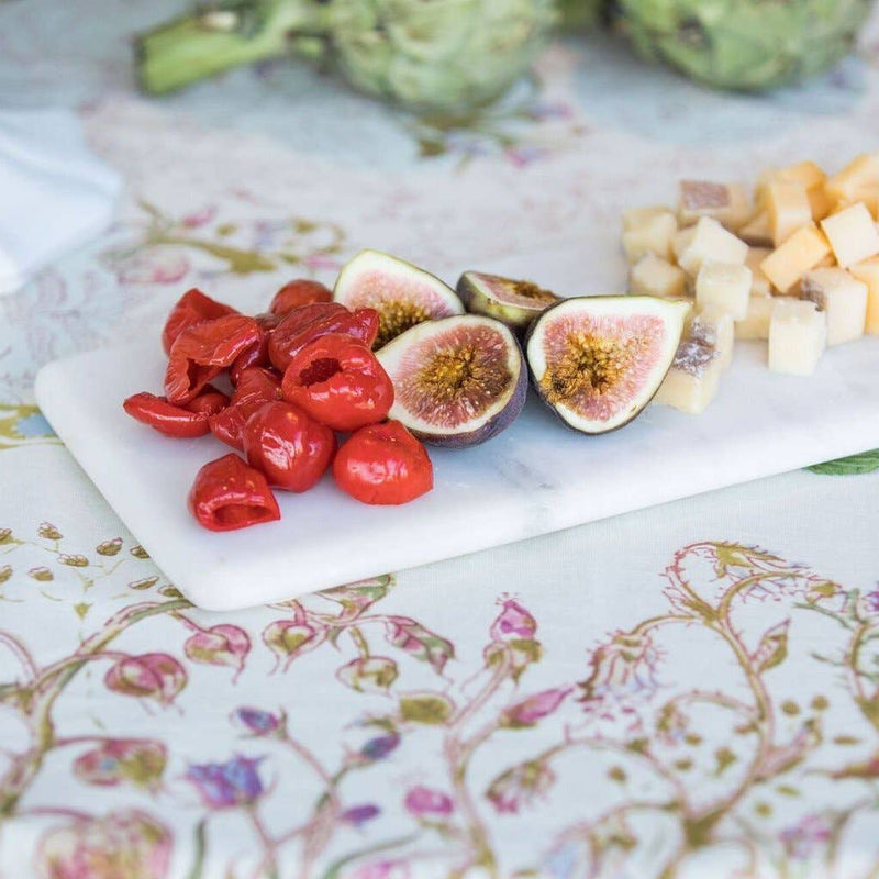 Pepe Marble Cheese Board displaying roasted red peppers, fresh figs, and cheese cubes, highlighting its elegant, natural marble design, ideal for sophisticated gatherings.