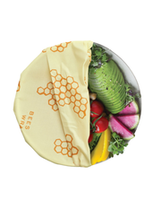 Bee's Wrap - Large 3 Pack Wraps displayed alongside fresh vegetables and fruits, showcasing its use for preserving kitchen items like leafy greens and herbs.